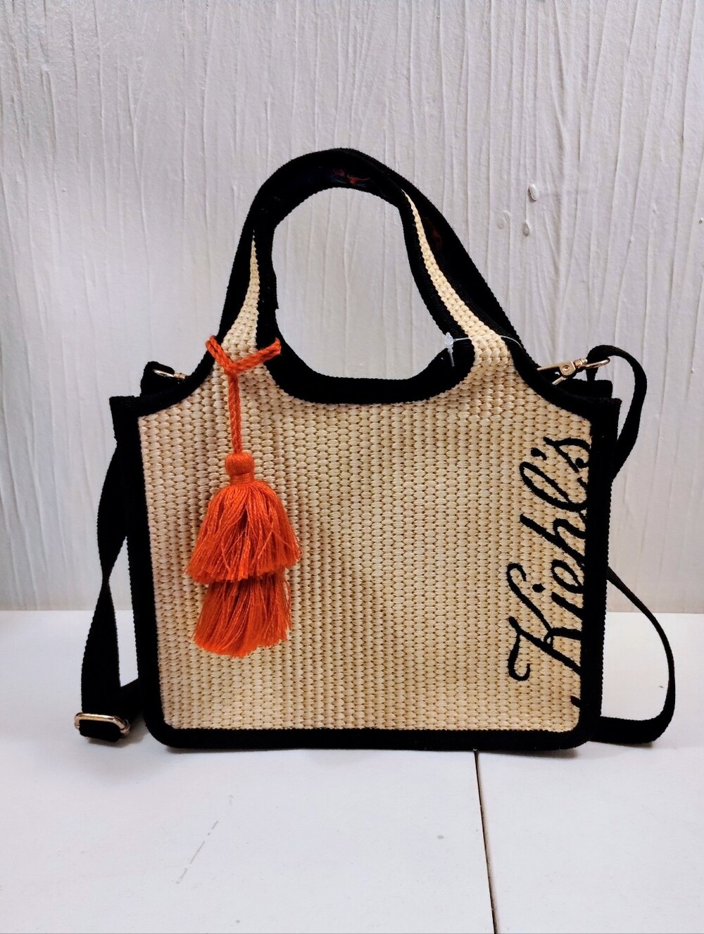 Kiehls TWL Resort & Spa Woven Straw Tote with Black Trim and Orange Tassel